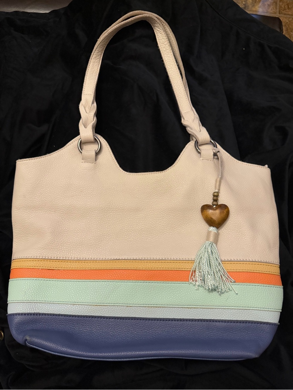 The Sak Neutral Tote with Pastel Stripe Accents and Heart Tassel